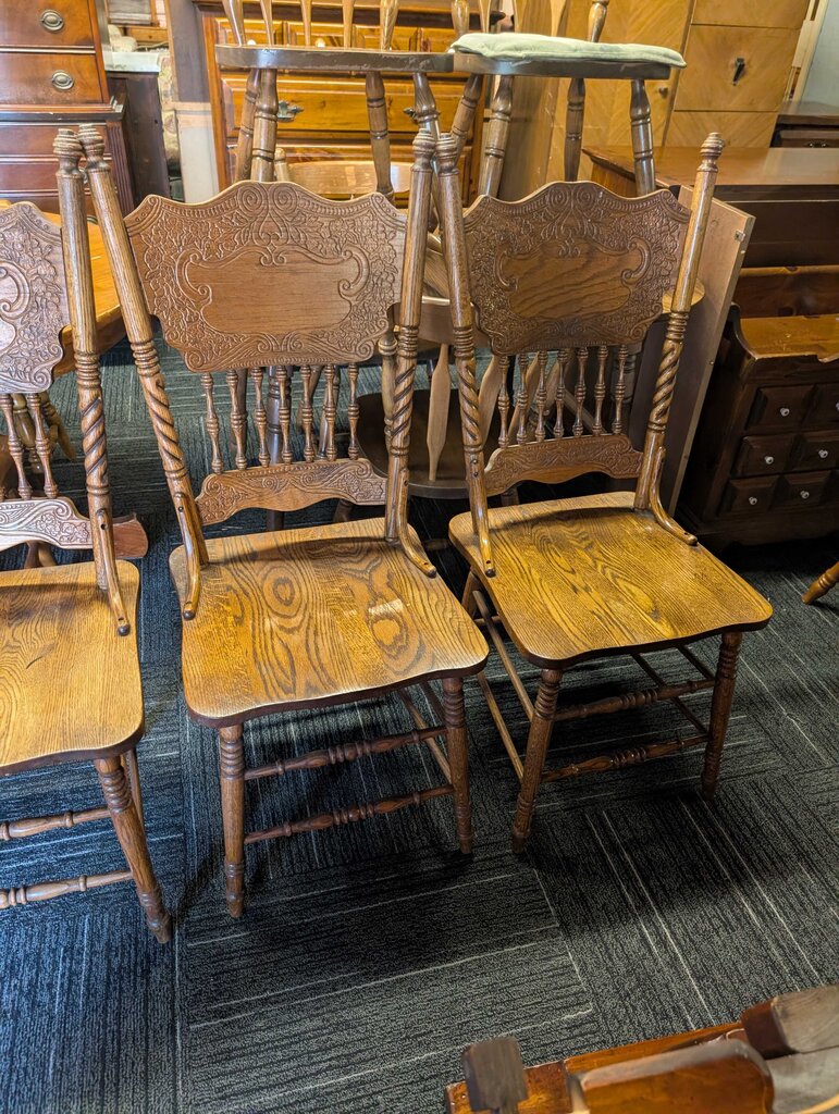 Four Oak Pressed Back Chairs