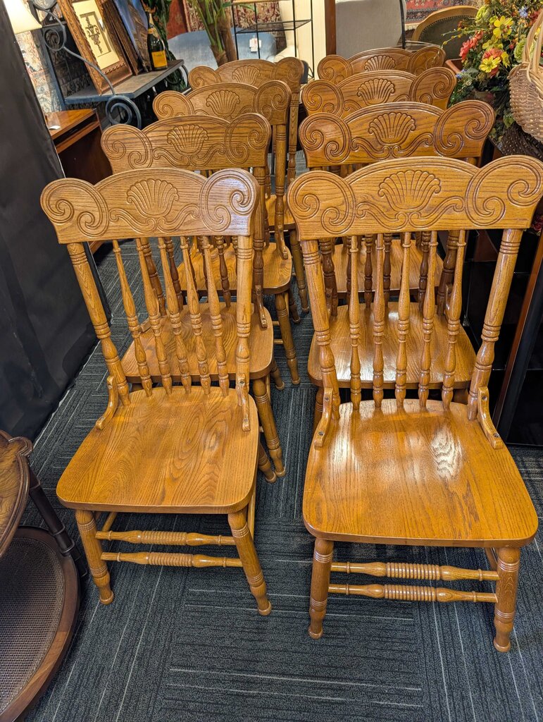 8 Vintage Oak Pressed Back Dining Chairs with Shell Motif
