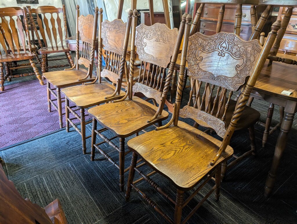 Four Oak Pressed Back Chairs